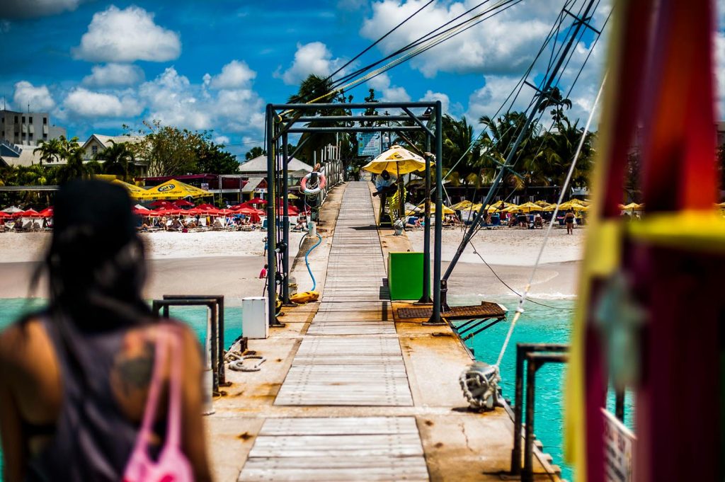Barbados: A year-round destination offering immersive travel experiences 3 Woman on a pier in Barbados.