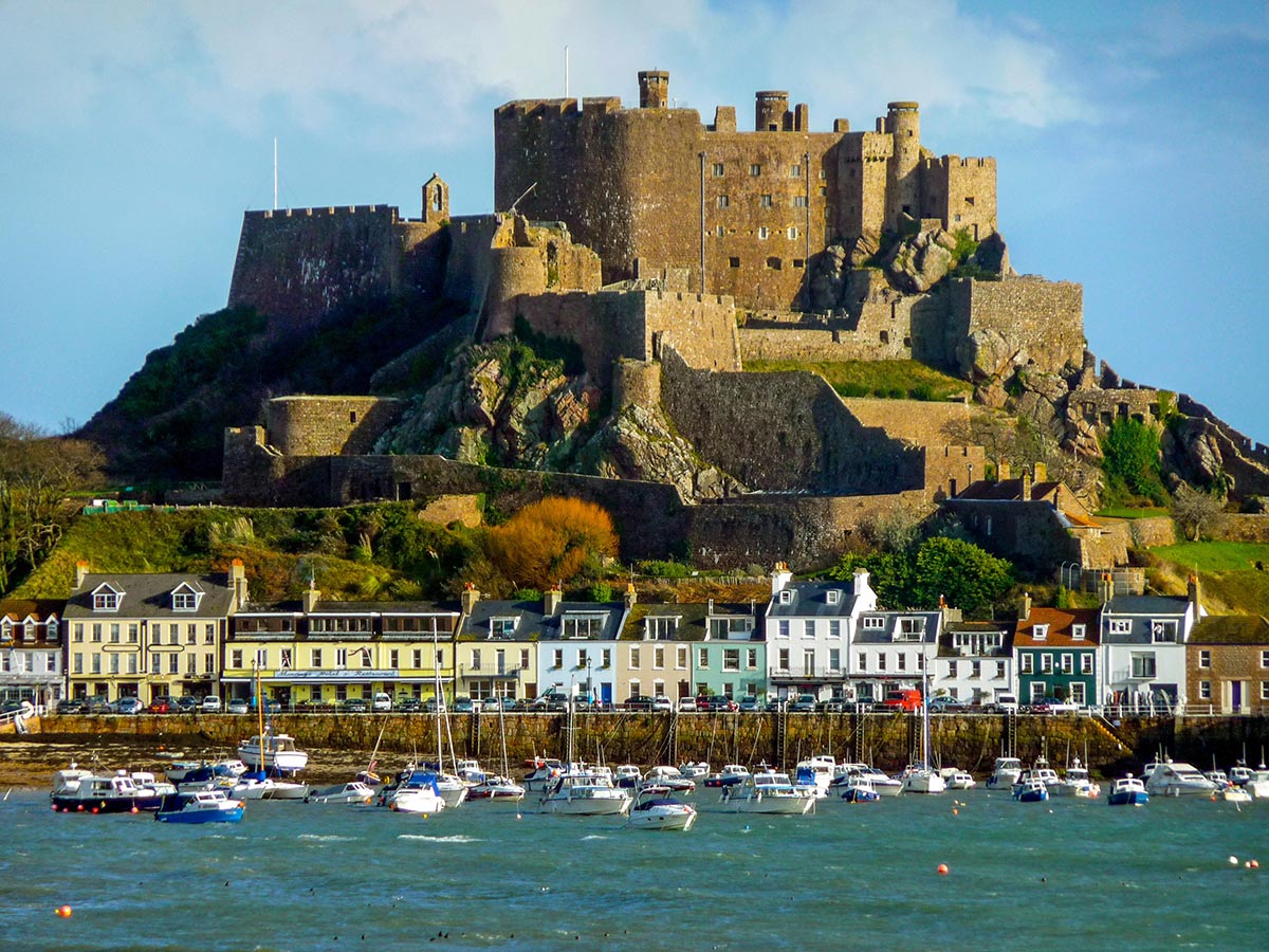 Airline update: easyJet, Jet2 and more 3 A scene from Jersey, including a castle and boats.