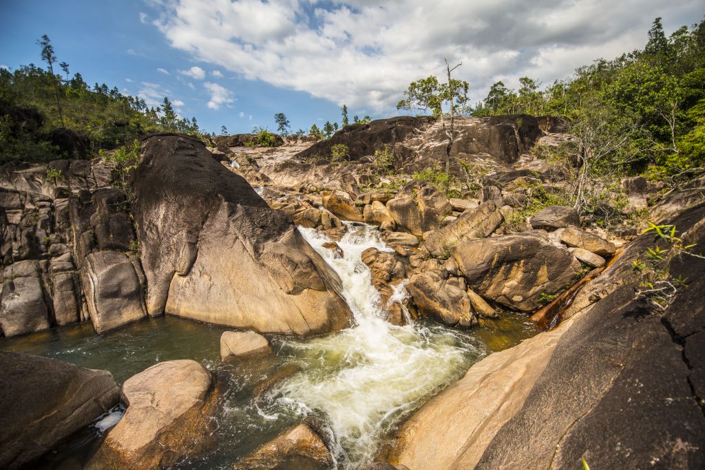 the Rio On Pools, a series of natural swimming holes and small waterfalls located within the Mountain Pine Ridge Forest Reserve in Belize