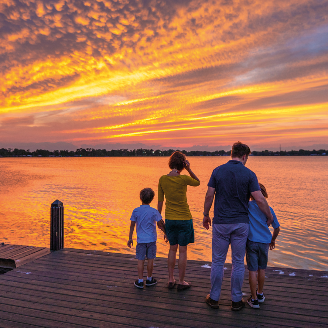 Florida; Family enjoying a sunset view at Lake Shipp Winter Haven Chain of Lakes