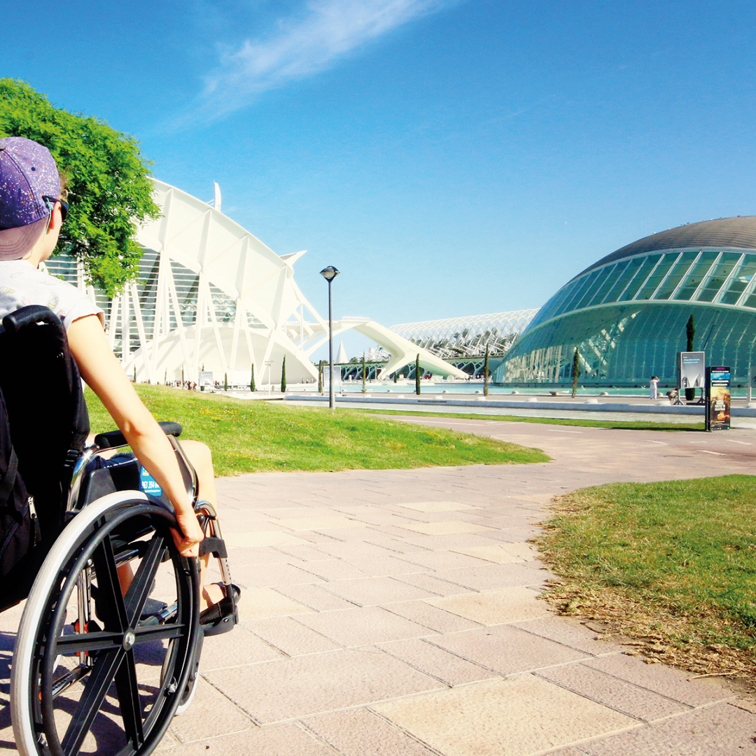A child in a wheelchair visiting the City of Arts and Sciences in Valencia