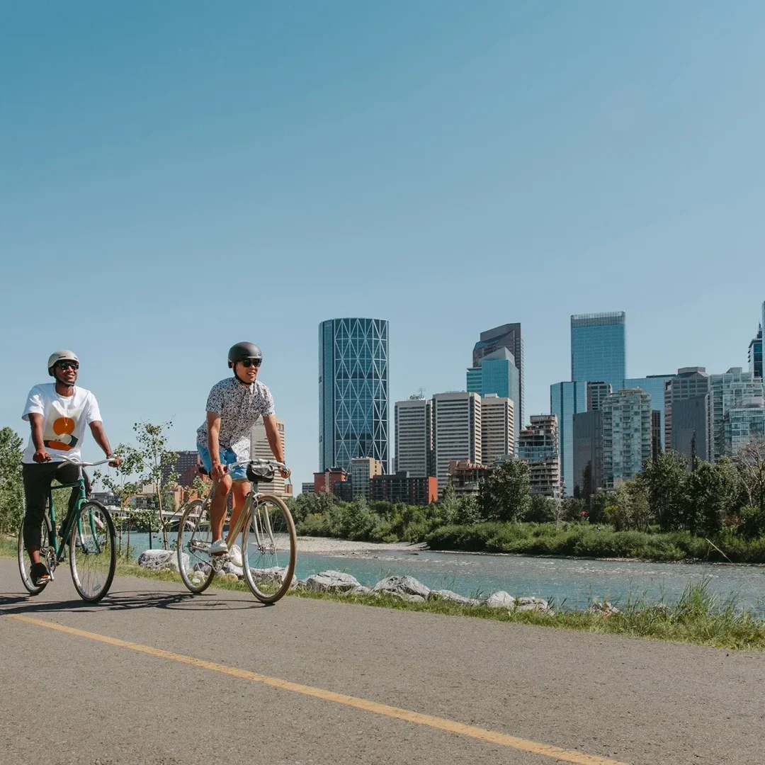 Two-cyclists-enjoying-a-bike-ride-along-Memorial-Drive-in-downtown-Calgary-Credit-Travel-Alberta-Mike-Seehagel-a17-020575