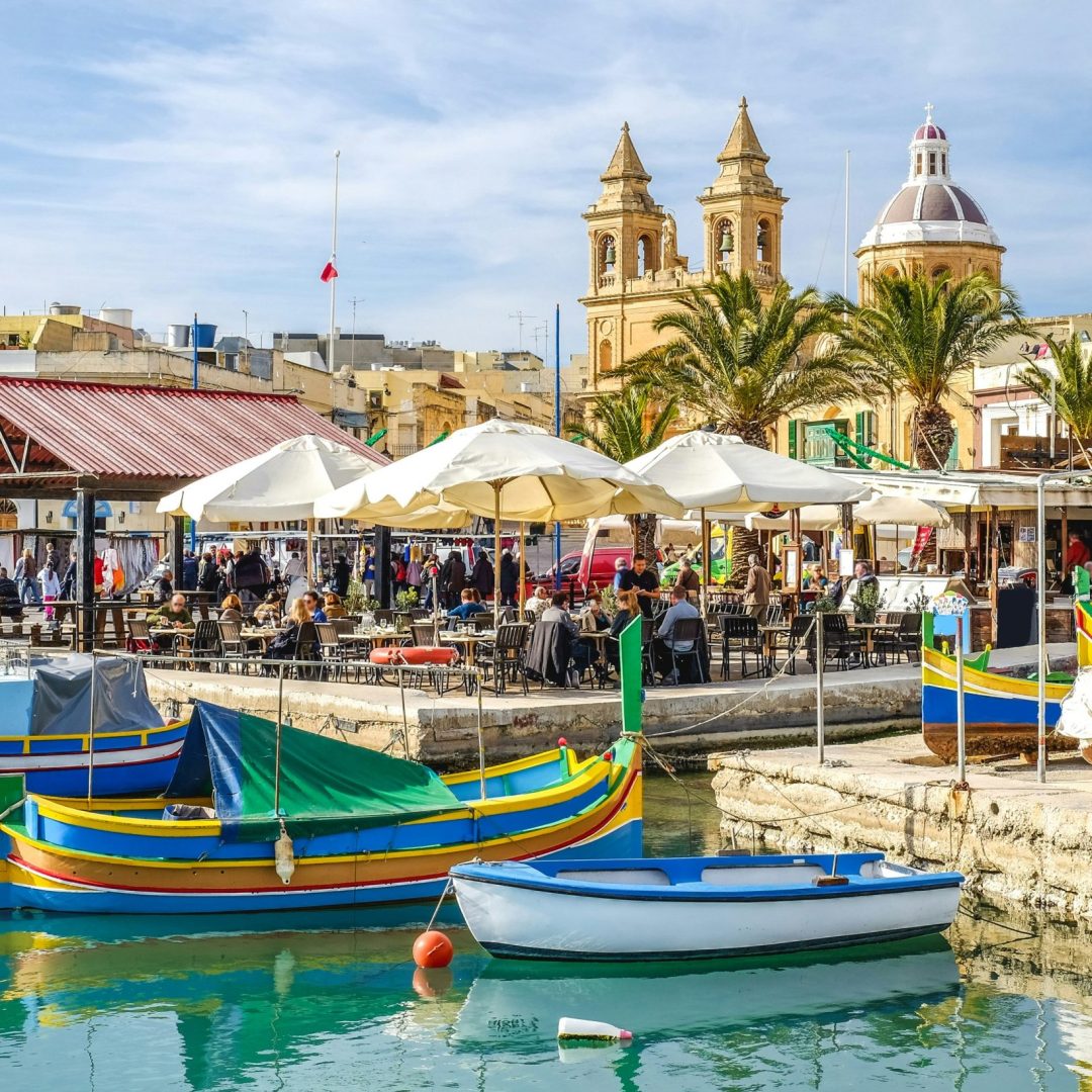 Colourful boats docked in the harbour in Malta