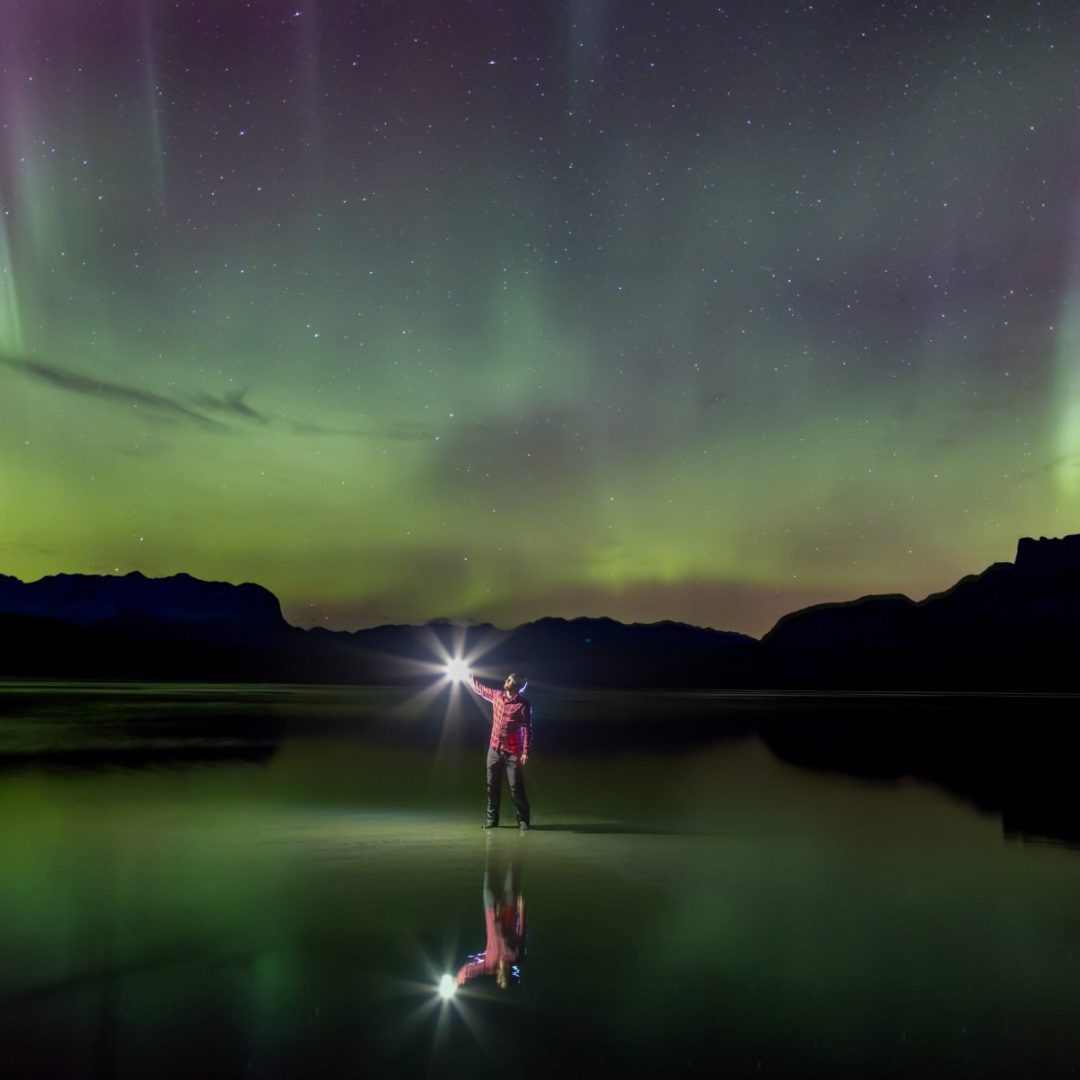 A man meets the Aurora's in Jasper National Park.