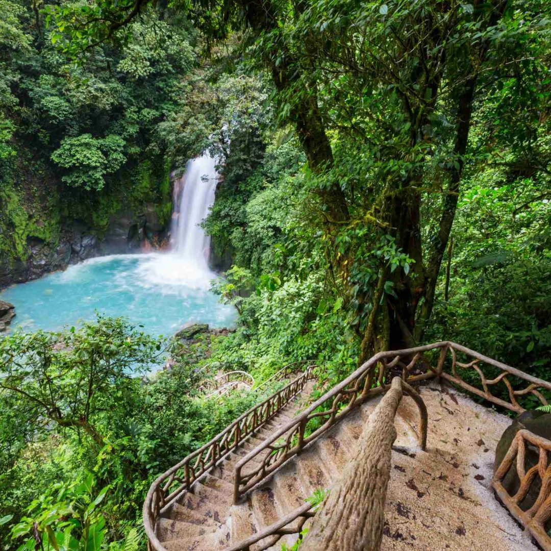 Majestic waterfall in the rainforest jungle of Costa Rica. Tropical hike.